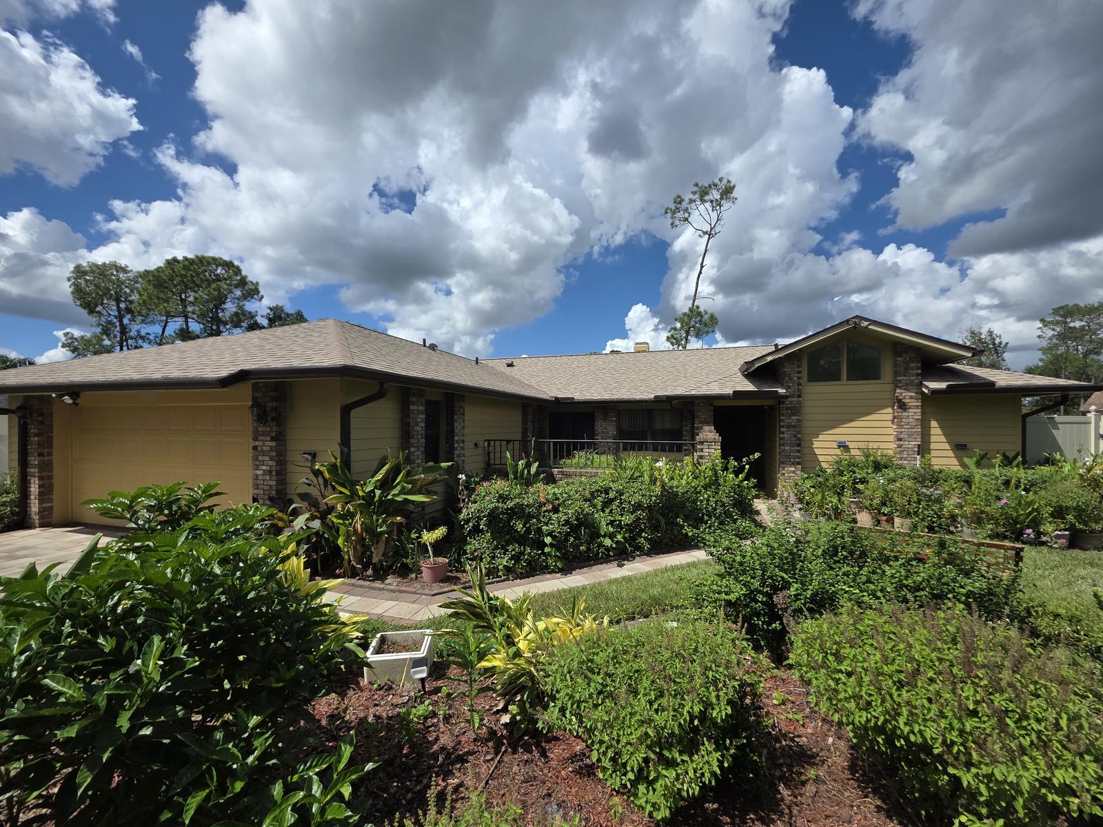 Exterior Repaint, Stucco Repairs and Siding Replacement